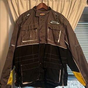 Clice MX (motocross) Gray and Black Jacket with Yellow Accents.